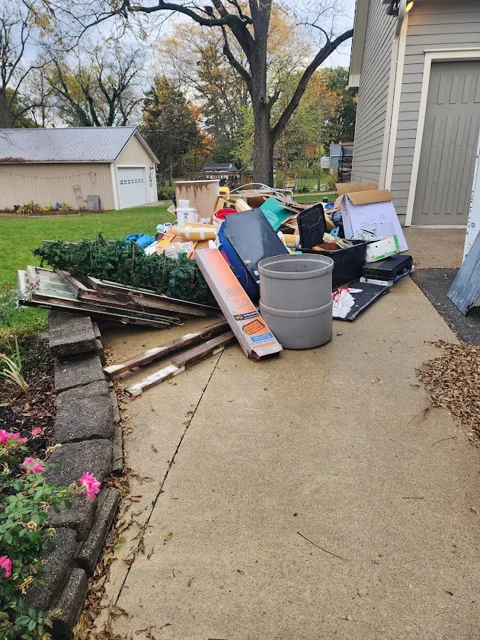 Dumpster being loaded with debris for Roofing Dumpster Rental in Hillsboro
